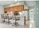 Kitchen features a breakfast bar and wood cabinets at 2542 Northway Dr, Venice, FL 34292
