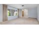 Living area with tiled entryway and neutral carpeting at 2542 Northway Dr, Venice, FL 34292