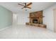 Living room features a stone fireplace and ceiling fan at 2542 Northway Dr, Venice, FL 34292