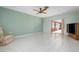 Living room with view of another room, tile floors and ceiling fan at 2542 Northway Dr, Venice, FL 34292
