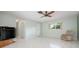 Living room with tile floor, ceiling fan and sliding door at 2542 Northway Dr, Venice, FL 34292