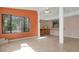 Sunroom with kitchen bar, tile floor, and view of the backyard at 2542 Northway Dr, Venice, FL 34292