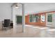 Sunroom with tile floor, view into another room, and access to a patio at 2542 Northway Dr, Venice, FL 34292