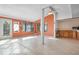 Bright sunroom features tile flooring, multiple windows, and access to the outdoors at 2542 Northway Dr, Venice, FL 34292