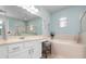 Bathroom with vanity, soaking tub and shower at 2558 Hobblebrush Dr, North Port, FL 34289