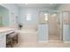 Bathroom with soaking tub and walk-in shower at 2558 Hobblebrush Dr, North Port, FL 34289