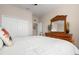 Bedroom with double doors and a large dresser at 2558 Hobblebrush Dr, North Port, FL 34289