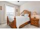 Bedroom with wooden bed frame and ample closet space at 2558 Hobblebrush Dr, North Port, FL 34289