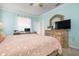Bedroom with workspace and peach bedding at 2558 Hobblebrush Dr, North Port, FL 34289