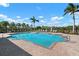 Relaxing community pool area with plenty of lounge chairs at 2558 Hobblebrush Dr, North Port, FL 34289