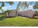 Single-story home with landscaped yard and attached garage at 2558 Hobblebrush Dr, North Port, FL 34289