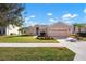 House exterior with a two-car garage and manicured lawn at 2558 Hobblebrush Dr, North Port, FL 34289