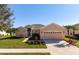 One-story house with a two-car garage and landscaped yard at 2558 Hobblebrush Dr, North Port, FL 34289