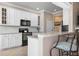 Modern kitchen with white cabinets and granite countertops at 2558 Hobblebrush Dr, North Port, FL 34289