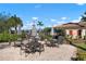 Community patio with tables, chairs, and umbrellas at 2558 Hobblebrush Dr, North Port, FL 34289