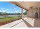 Bright screened porch with lake view and ceiling fan at 2558 Hobblebrush Dr, North Port, FL 34289