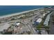 Aerial view of a beachside neighborhood with ocean and road views at 2899 Ensenada Ln, North Port, FL 34286