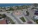 Aerial view of a beachside roundabout with ocean views at 2899 Ensenada Ln, North Port, FL 34286