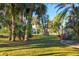 Landscaped backyard with lush tropical foliage at 2899 Ensenada Ln, North Port, FL 34286