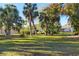Large backyard with lush tropical landscaping at 2899 Ensenada Ln, North Port, FL 34286