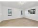 Spacious bedroom with light walls, wood-look floors, and ample natural light at 2899 Ensenada Ln, North Port, FL 34286