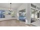 Sunlit dining area with sliding doors leading to the pool and patio at 2899 Ensenada Ln, North Port, FL 34286