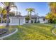 Bright and airy home with a well-maintained lawn at 2899 Ensenada Ln, North Port, FL 34286