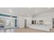 Modern kitchen with white cabinets, stainless steel appliances, and an island at 2899 Ensenada Ln, North Port, FL 34286