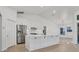 Modern kitchen with white cabinets and stainless steel appliances at 2899 Ensenada Ln, North Port, FL 34286