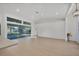 Open living area with light flooring and large windows overlooking the pool at 2899 Ensenada Ln, North Port, FL 34286
