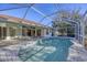 Relaxing screened pool and spa with paver deck at 2899 Ensenada Ln, North Port, FL 34286