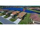 Aerial view of a house with a lake view in a residential community at 295 Cassano Drive, Nokomis, FL 34275
