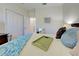 Comfortable bedroom with a queen bed and built-in closet at 295 Cassano Drive, Nokomis, FL 34275