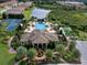 Resort-style community pool with tennis courts and clubhouse at 295 Cassano Drive, Nokomis, FL 34275