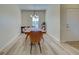 Bright dining room with a wood table and leather chairs at 295 Cassano Drive, Nokomis, FL 34275