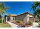 House exterior featuring a blue door and walkway at 295 Cassano Drive, Nokomis, FL 34275
