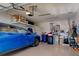 Organized garage with overhead storage and ample space for a car at 295 Cassano Drive, Nokomis, FL 34275