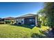 House exterior with screened patio at 295 Cassano Drive, Nokomis, FL 34275