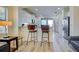 Kitchen boasts modern cabinetry and stainless steel appliances at 295 Cassano Drive, Nokomis, FL 34275