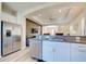 Modern kitchen with stainless steel appliances and breakfast bar at 295 Cassano Drive, Nokomis, FL 34275