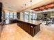 Community clubhouse kitchen features a large island and stainless steel appliances at 295 Cassano Drive, Nokomis, FL 34275