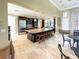 Community clubhouse kitchen with large island, stainless steel appliances, and granite countertops at 295 Cassano Drive, Nokomis, FL 34275