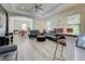 Open living area with modern furniture and hardwood floors at 295 Cassano Drive, Nokomis, FL 34275