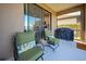 Patio with seating and grill, view of the lake at 295 Cassano Drive, Nokomis, FL 34275