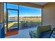 Relaxing screened patio overlooking a lake at 295 Cassano Drive, Nokomis, FL 34275