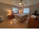 A bedroom is furnished with a bed, dresser, and two windows at 356 Longwood Dr, Venice, FL 34285