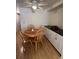Cozy dining area featuring a round table, four chairs, and a built-in cabinet at 356 Longwood Dr, Venice, FL 34285