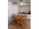 Cozy dining area featuring a round table, four chairs, and a built-in cabinet at 356 Longwood Dr, Venice, FL 34285
