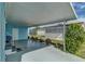 Covered patio featuring lattice, greenery and a view to the backyard at 356 Longwood Dr, Venice, FL 34285