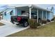 Light blue home with carport and landscaping at 356 Longwood Dr, Venice, FL 34285